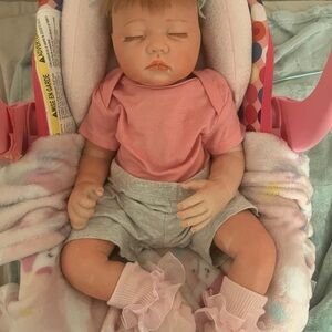 Realistic Baby Doll in Pink and Gray Outfit